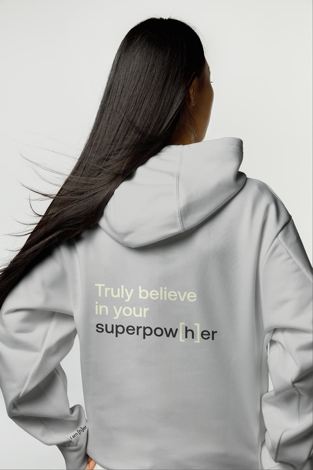 Model wearing together brand empowerment hoodie - sustainable women's fashion with impact statement